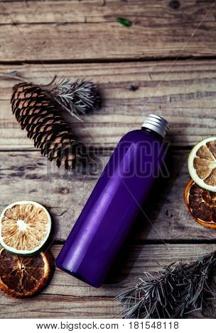 Pine grapefruit shampoo on wooden background. Organic and natural cosmetics for healthy and beautiful hair. and