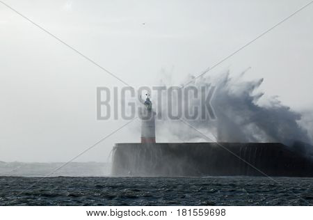 Newhaven Lighthouse in East Sussex England during Storm Doris in February 2017