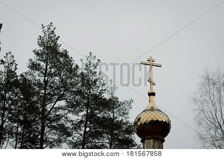 Church dome against the sky in cloudy weather