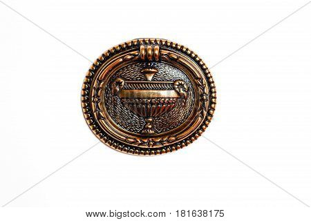Golden Metal Knob With Decorative Elements On Fancy White Cabinet