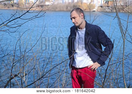 Depressed angry man in forest early spring