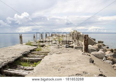 Landscape of old stone pier and sea