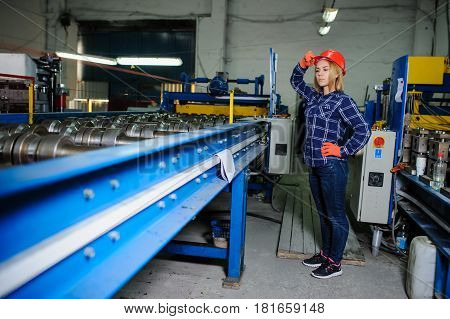 Beautiful Woman In Red Safety Helmet Work As Industrial Worker