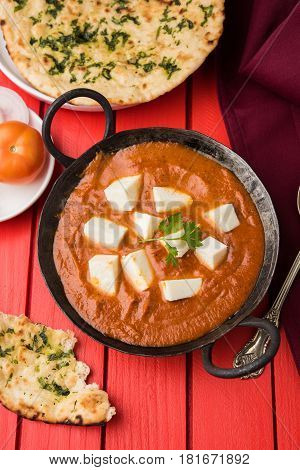 paneer butter masala or cheese cottage curry, popular indian lunch/dinner menu in weddings or parties, selective focus