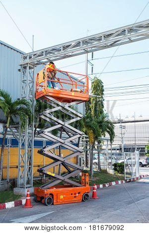 Scissor lift platform and electrical technician operated wiring.
