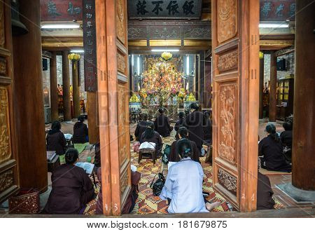 Hanoi Vietnam - Feb 20 2017 : Vietnamese monks praying at Chua Ba Da temple in Hanoi Vietnam