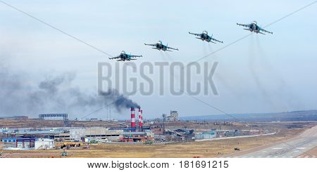 Military jet flying over the city at a low height