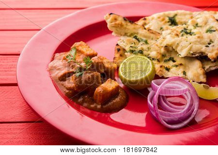 paneer butter masala or cheese cottage curry, popular indian lunch/dinner menu in weddings or parties, selective focus
