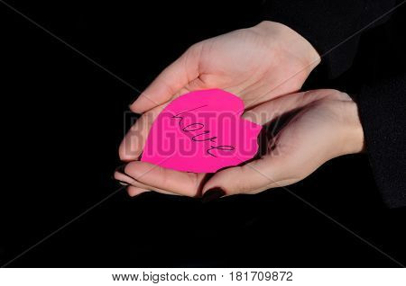 Love heart in the beautiful girl hands