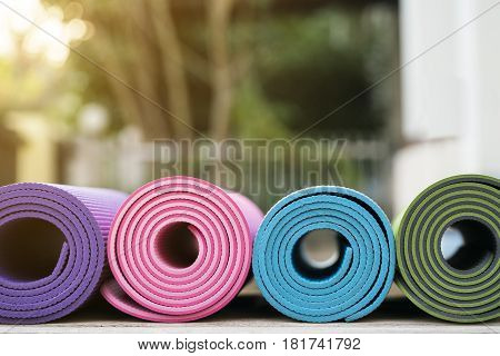 yoga mat on wooden table, close up