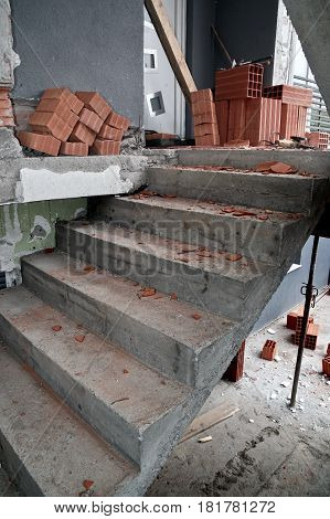 Build a house with brick wall and concreted stairs