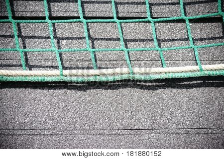 The close-up of stacked Styrofoam plates for heat insulation of a building which are fixed with a net.