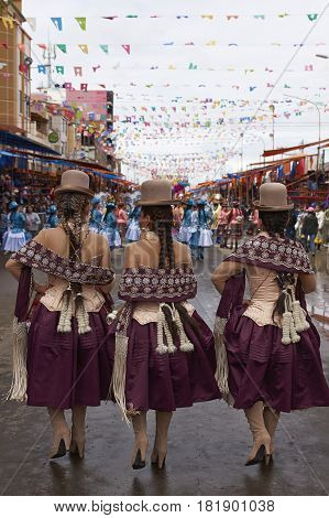 ORURO, BOLIVIA - FEBRUARY 26, 2017: Morenada dance group in colourful outfits parading through the mining city of Oruro on the Altiplano of Bolivia during the annual Oruro Carnival.