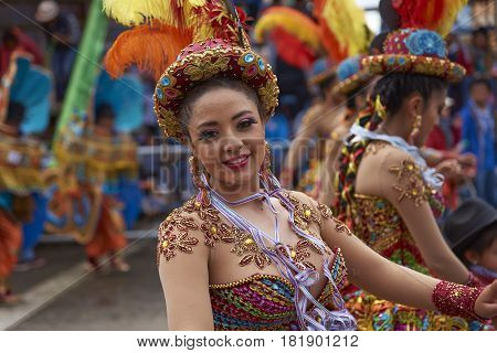ORURO, BOLIVIA - FEBRUARY 26, 2017: Morenada dance group in colourful outfits parading through the mining city of Oruro on the Altiplano of Bolivia during the annual Oruro Carnival.