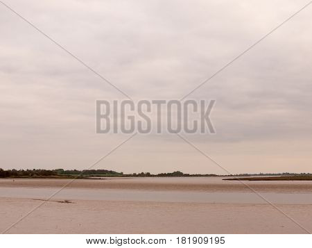 Low Tide Summer Sky Nightfall Grey Clouds Mood And Reds With River Running Through In Wivenhoe Essex