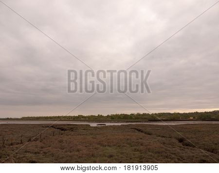 Low Tide Summer Sky Nightfall Grey Clouds Mood And Reds With River Running Through In Wivenhoe Essex