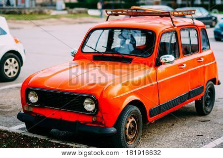 Red retro car in Montenegro, marks of Zastava, production of Yugoslavia.