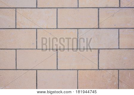 Background wall made of stone. Fragment of a wall from a chipped stone