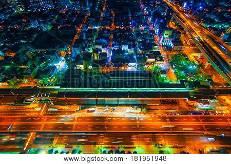 The image of the night city from the height of a bird's flight.A view of the night Osaka.Mnogo houses in iluminatsii.Dark time of the day