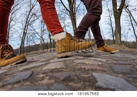 Two Walk In Shoes Along The Pavement. Walk In The Fresh Air