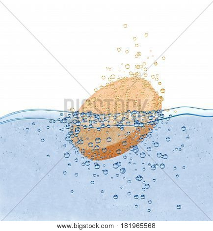 Medical pill dissolves in water on white background