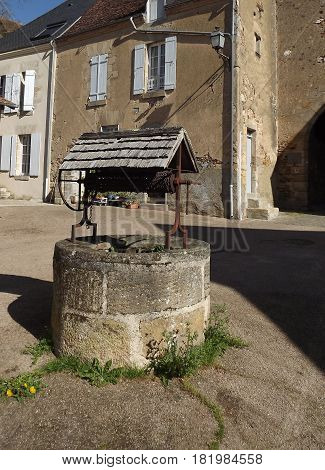 Ancient French water well at Ste Severe in central France