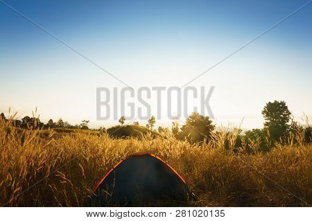 Outdoors Camping Grass Highlands Mountain In The Sunset.
