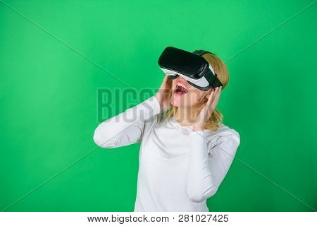 Woman Using Virtual Reality Headset. The Woman With Glasses Of Virtual Reality. Woman Wearing Virtua