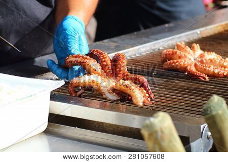 Cook Cleans And Prepares An Octopus For Cooking On The Grill