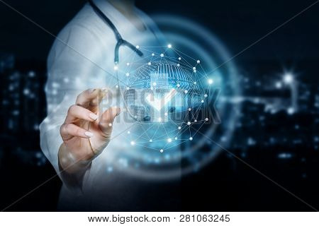 A Closeup Of Doctor With Stethoscope Operating With Digital System Of Medical Sign And Quality Symbo