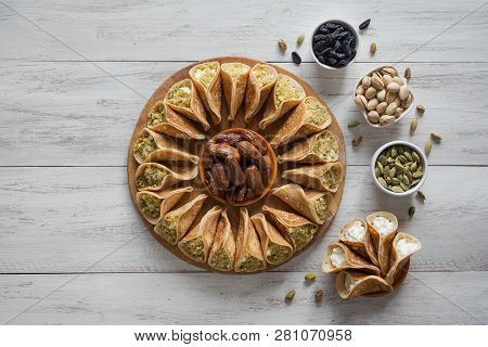 Arab Sweets. Arabian Pancake Stuffed With Sweet Cheese And Pistachios.