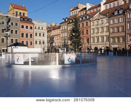 Warsaw, Poland On December 2018: Scenic Buildings At Old Town Market Place And Icerink In European C
