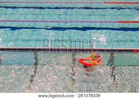 Poznan, Poland - January 26, 2019: Young Boy Learning To Swim With A Stick During Swimming Leasson I