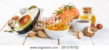Selection Of Healthy Unsaturated Fats, Omega 3 - Fish, Avocado, Olives, Nuts And Seeds