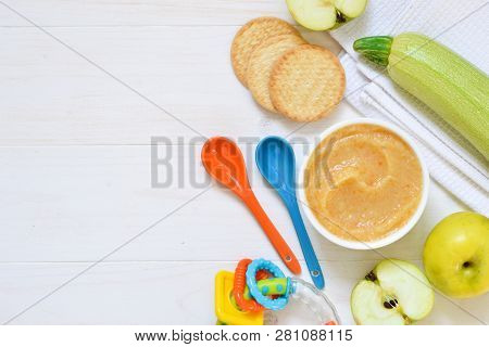 Baby Food From 6 Months. Vegetable Puree From Courgettes, Stamps And Potatoes On A Concrete Backgrou