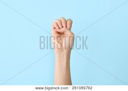 Woman Showing E Letter On Color Background, Closeup. Sign Language