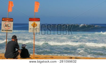 Haleiwa, United States Of America- January 13 2015: Wide Shot Of The Beach And The Surfers In The Wa
