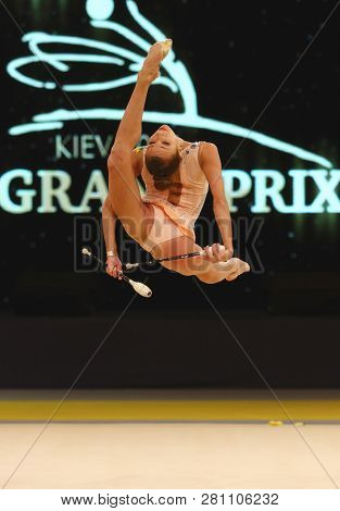 Kyiv, Ukraine - March 18, 2017: Rhythmic Gymnast Viktoria Mazur Of Ukraine Performs With Clubs Durin