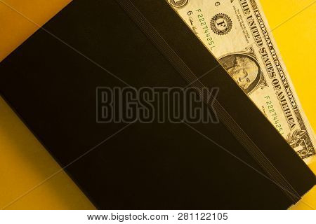 Dollars Inside Of The Notepad. Political Corruption Concept.