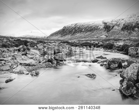 Pools And Majestatic Waterfalls Belllow Snowy Mountains. Blue Water Mirrorong Blue Cloudy Sky