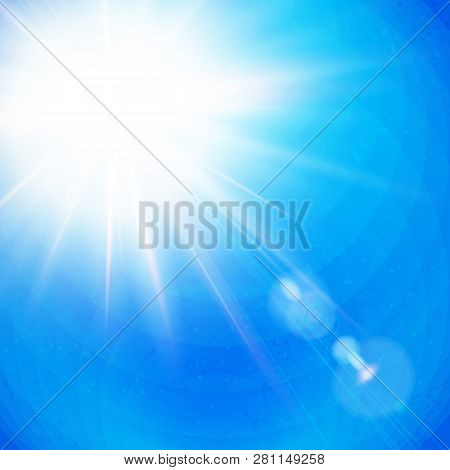 Vivid Sunburst With Radiating Rays In A Clear Blue Sky.