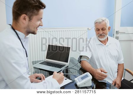 Crop Closeup Horizontal Portrait Of Two Men In Hospital. Young Smiling Confident Professional Doctor
