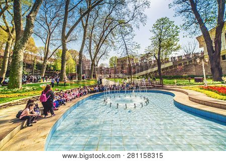 Istanbul, Turkey: Children With Their Teacher At The Pool In Gulhane Park During The Annual April Tu