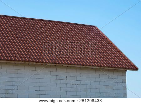The Roof Of The House Under Red Shingles
