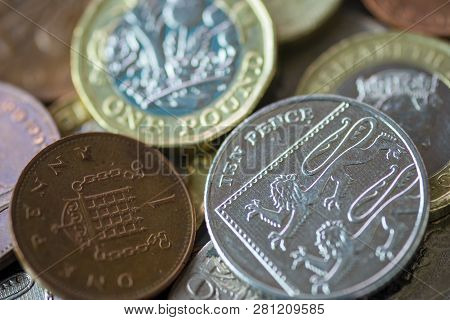 Close Up Of Fractional Currency Coins Of Pound Sterling Such As Ten Pence And One Pound . Saving And