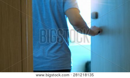 Motion Blurred Scene Of Hand Man Open The Door Into His Hotel Room After Using An Electronic Securit