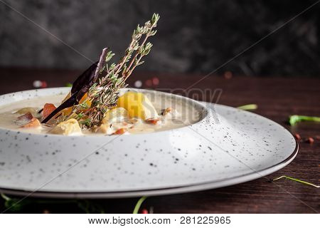 American Cuisine Concept. American Soup Clam Chowder With Chicken Broth And Milk, With Bacon And Mus