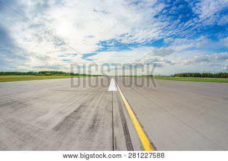 Runway Clear For Take Off, Airstrip With Marking On Blue Sky With Clouds Background. Travel Aviation
