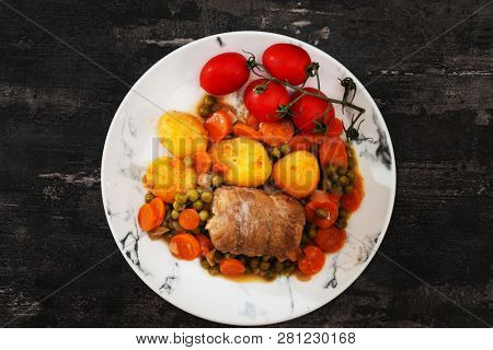 Beef meat stewed with potatoes-Traditional French cuisine Beef Bourguignon potatoes carrots in persillade