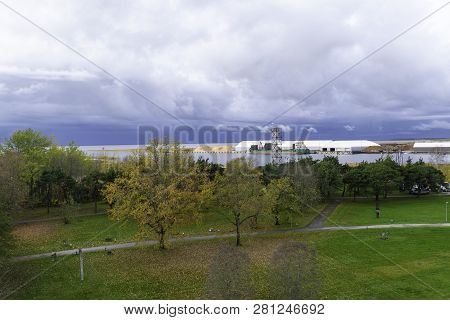 Aerial View Over Port Of Eesti Gloomy Sky Before Storm